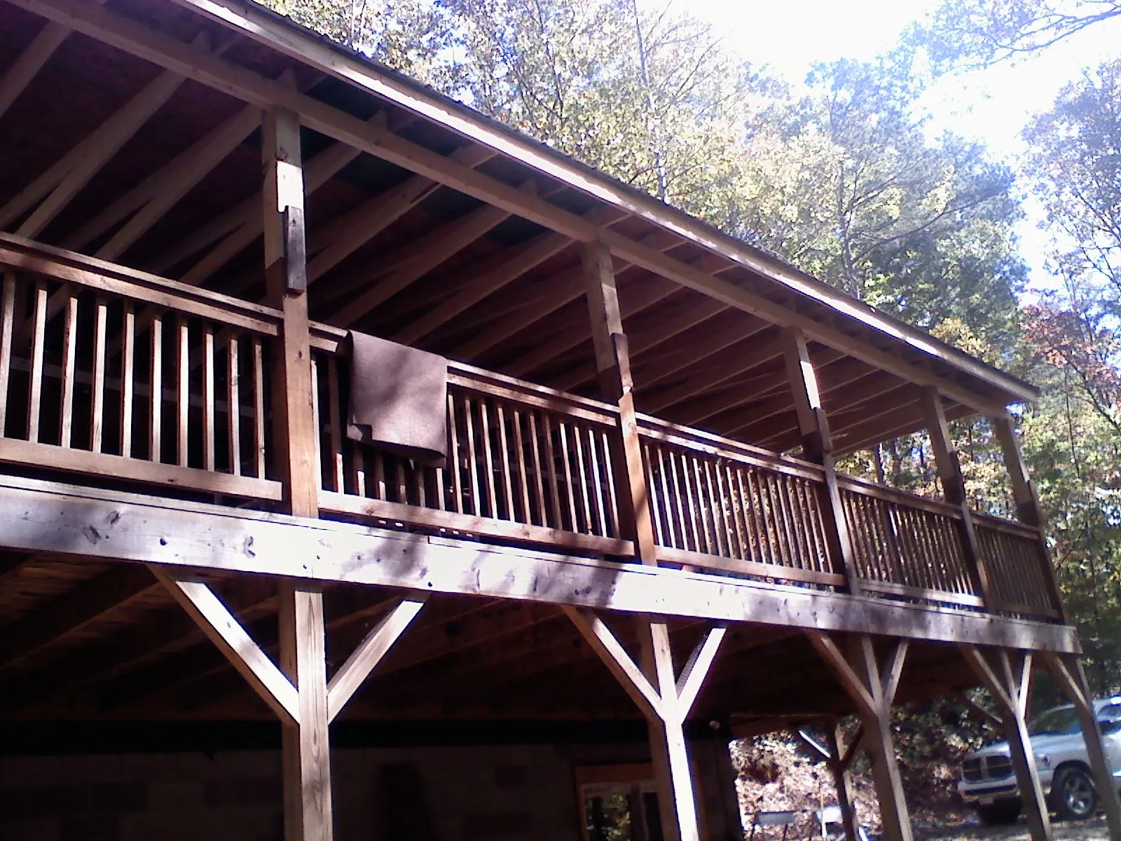 Timber framing under a new elevated porch and deck in Wood River Junction